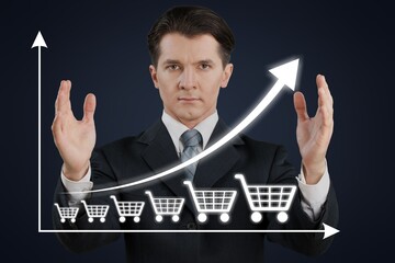 Wall Mural - Business person with graph and shopping cart