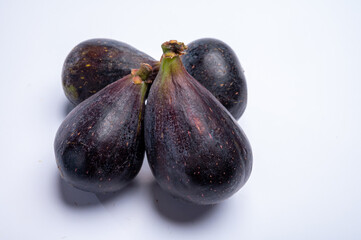 Fresh ripe organic figs fruits ready to eat close up isolated on white background