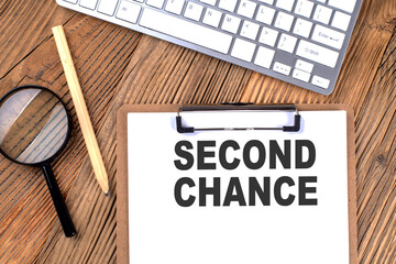 Poster - SECOND CHANCE text on paper clipboard with magnifier and keyboard on wooden background