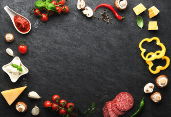  Frame of set ingredients for cooking italian pizza on a dark stone background, top view