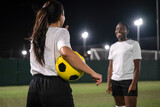 Fototapeta Fototapeta Londyn - Female soccer players in playing field