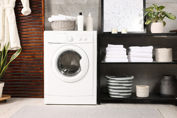 Wall Mural - Stylish laundry room with modern washing machine. Interior design