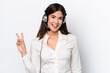 © luismolinero - Telemarketer caucasian woman working with a headset isolated on white background smiling and showing victory sign