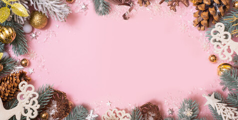 Wall Mural - Merry Christmas or Happy Holidays blank greeting card with Xmas decoration on pink background. Noel. Flat lay