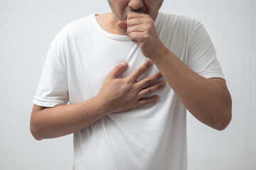 man wearing white shirt coughing on white background