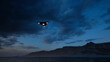 3D-rendering. Triangular ufo hung in the sky in the evening	
