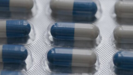 Poster - blue-white capsules rotate in a circle