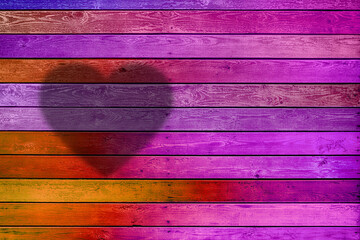 Aufkleber - background of horizontal multi-colored wooden planks with a silhouette of a heart