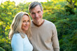 © PhotoAlto - Portrait of middle-aged heterosexual couple posing outdoors