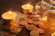 South African coins and candles. Concept of loadshedding or rising energy costs