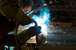 © Designpics - A journeyman welder installing a lift lug using a MIG welder in a metal fabrication plant; Innisfail, Alberta, Canada
