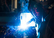 © Designpics - A journeyman welder installing a lift lug using a MIG welder in a metal fabrication plant; Innisfail, Alberta, Canada