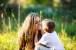 © Designpics - A mother spending quality time with her young son, outdoors in a city park; Edmonton, Alberta, Canada