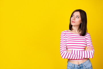 Sticker - Portrait of young attractive serious business lady folded hands look empty space company ad isolated on yellow color background