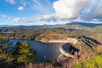 High angle view landscape of concrete dam of El Atazar with a beautiful clouds in the sky, Madrid, Spain