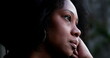 Contemplative African woman thinking, close-up black person face thoughtful