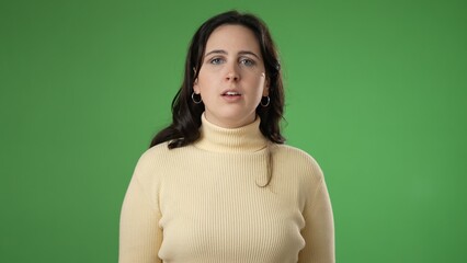 Portrait of serious happy young hipster woman 20s isolated on green screen background with copy space in studio