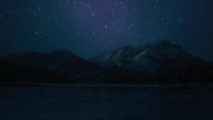 Wall Mural - Night sky full of stars above the snowy mountain peaks and a lake. Night timelapse. 