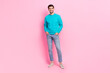 Full size photo of handsome young guy posing shopping banner promo toothy smile wear trendy blue garment isolated on pink color background