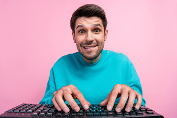 Aufkleber - Photo portrait of handsome young guy bite lips programmer addicted internet user wear trendy blue look isolated on pink color background