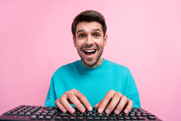 Aufkleber - Photo portrait of nice young guy excited typing working keyboard computer wear trendy blue garment isolated on pink color background