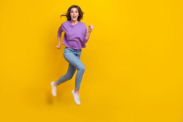 Sticker - Full size photo of crazy carefree girl jumping running empty space isolated on yellow color background