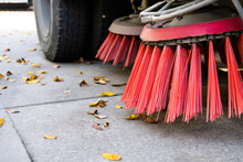 Close Up Of Street Sweeper Cleaning City Street