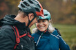 © Flamingo Images - Mature couple smiling after a mountain bike ride together