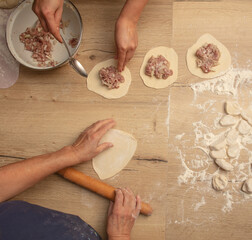 Sticker - Cooking dough with meat on the table.