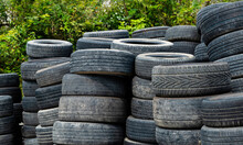 A Pile Of Old Car Tires