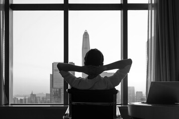 Wall Mural - Businesswoman sitting in front of the window