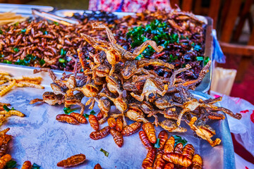 Poster - Extreme snacks of Thailand, grilled frogs and larvas on Chinatown's night market in Bangkok, Thailand