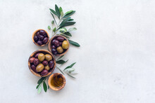 Wooden Bowls With Delicious Olives And Oil, With Free Space