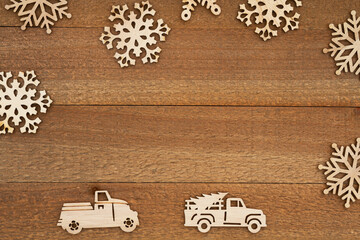 Wall Mural - Wood snowflakes and retro trucks on weathered wood holiday background