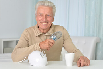 Poster - Portrait of sick old man with inhaler