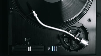 Wall Mural - DJ turntable plays vinyl disc with music in vertical video. Flat lay footage of disc jockey record player