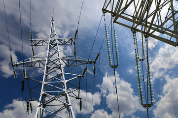 Wall Mural - Electricity pylon (high voltage power line) on the background of the cloudy sky