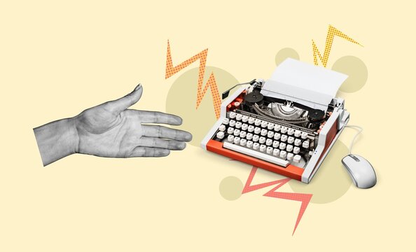 Creative arm typing on retro typewriter