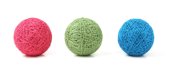 Wall Mural - three cotton thread balls isolated on white background. knitting balls of cotton string of different