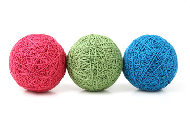Wall Mural - three cotton thread balls isolated on white background. knitting balls of cotton string of different