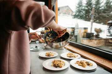 cooking scrambled eggs with mushrooms for breakfast