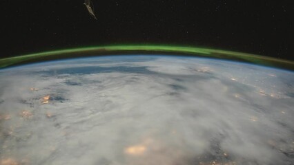Wall Mural - aurora borealis above the clouds at night. as seen from the international space station. elements of