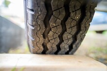 Tyre Blocks Stuck Behind A Wheel, For A Trailer In A Park For Camping