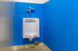 white urinal in men's bathroom
