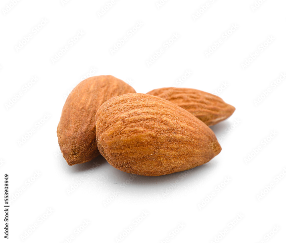Few tasty almonds on white background