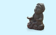 © nonneestudio - antique black meditating monkey on blue background, object, animal, decor, gift, cute, fashion, copy space