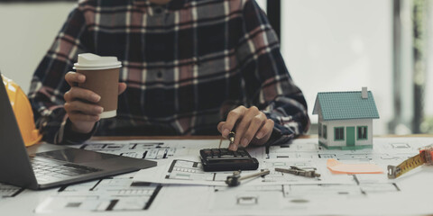 Concept architects, engineer holding pen pointing equipment architects On the desk