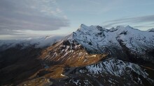 Aerial drone view of snow capped grossglockner mountains of Austria at sunset