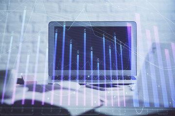  Forex Chart hologram on table with computer background. Double exposure. Concept of financial markets.