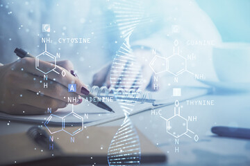 Poster - DNA theme hologram over woman's hands writing background. Concept of education. Double exposure